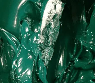 Close-up of vibrant Kelly Green plastisol ink with metallic sheen, ideal for screen printing on various fabrics.