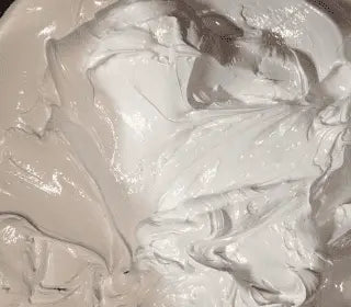 Close-up of Miracle White Plastisol Ink for screen printing, showcasing its creamy texture and opacity.