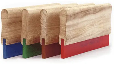 Wooden squeegees in red, green, and blue for screen printing with plastisol and water-based inks.